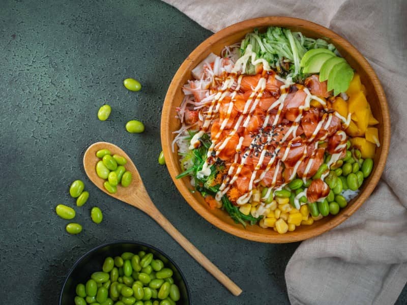 Salmon poke bowl with spices on the side | Kaboom Hotel